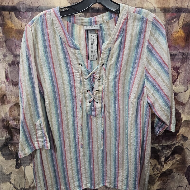 Short sleeve tunic style linen top in a multicolored stripe.