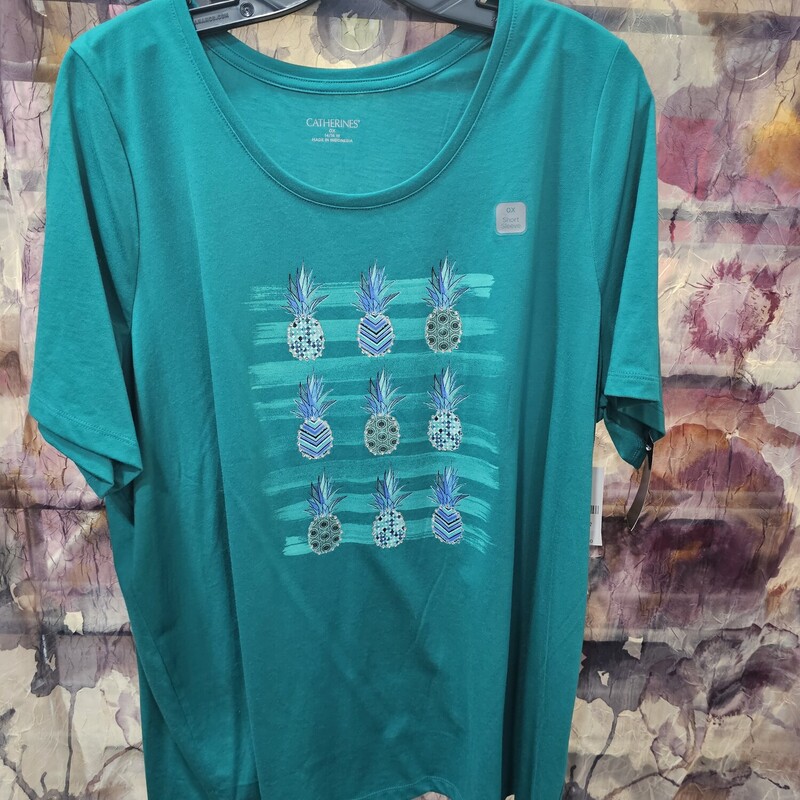 Brand new with tags and retails for $28. This is a short sleeve tee in green with pineapples and bling