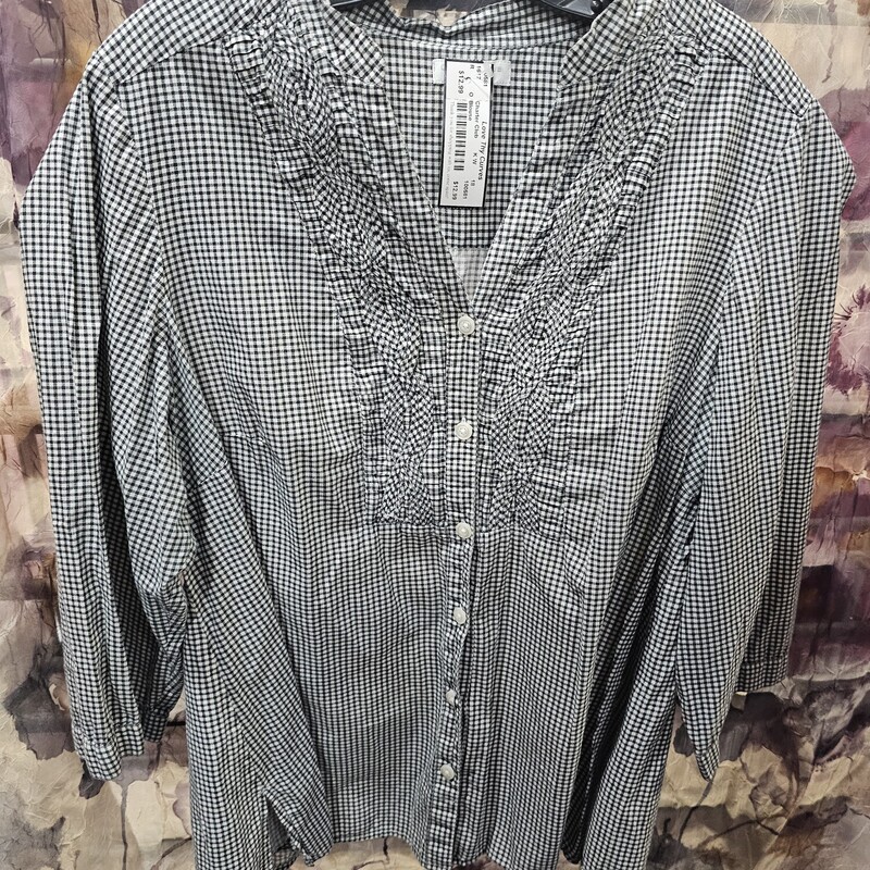 Super cute blouse in a black and white check pattern with button up front