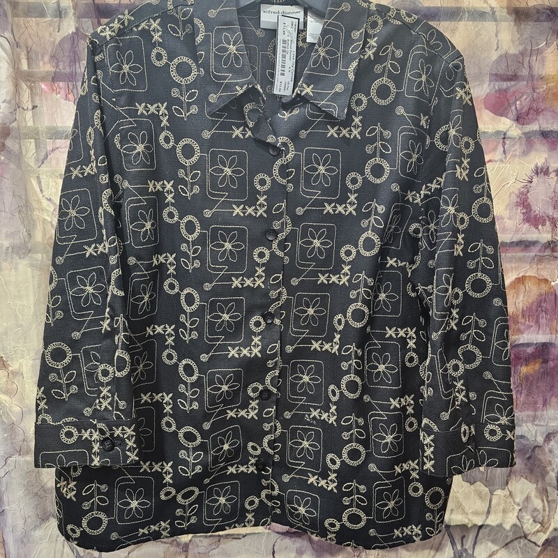 Black button up top with tan embroidered design.