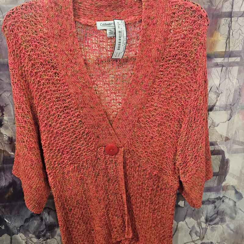 Super cute sweater with short sleeves, light weight and one button faux closure.