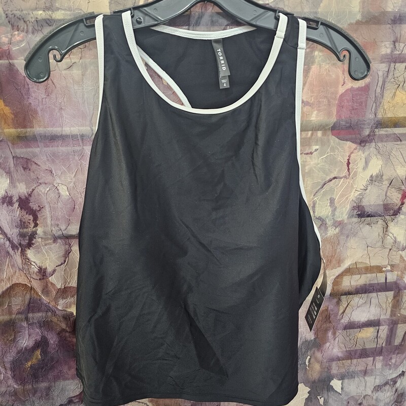 Brand new with tags, this activewear top with built in bra retails for $75!