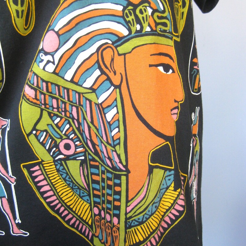 Fabulous like new high quality tee purchased at the Luxor Hotel and Casino in Las Vegas, NV in the 90s.<br />
It's longish so might serve as a summer dress or swim coverup as well as a shirt.<br />
Beautiful and vivid ancient Egyptian art on the front<br />
<br />
Marked size L but will be better for a size medium imo<br />
flat measurements:<br />
shoulder to shoulder: 19<br />
armpit to armpit: 21 3/4<br />
length: 30<br />
<br />
Like new condition, I don't believe it was ever worn or washed.<br />
<br />
Thanks for looking!<br />
#65713