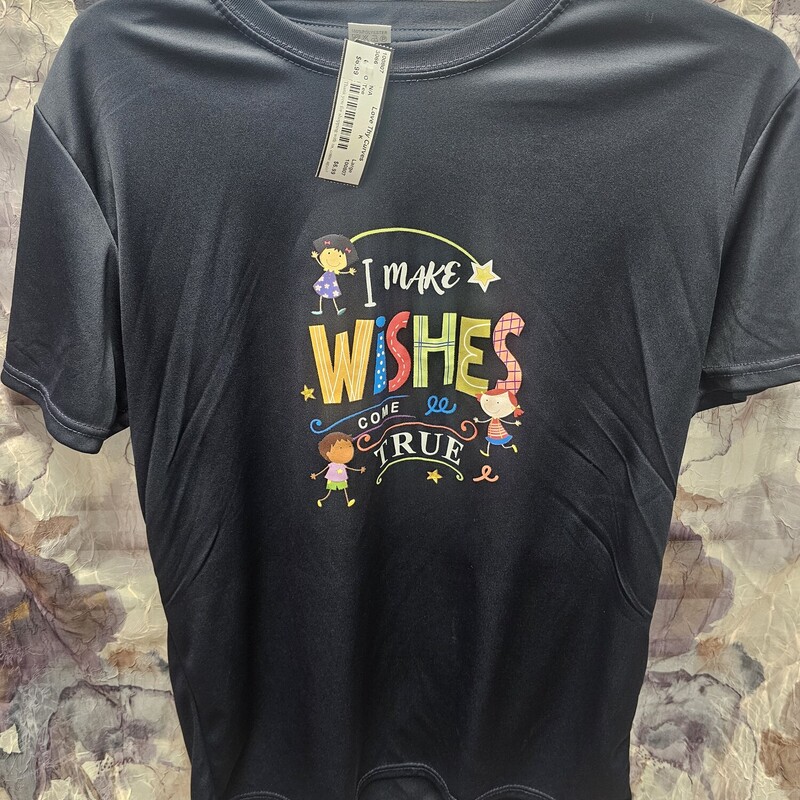 Black short sleeve top with I make wishes come true graphic on the front.