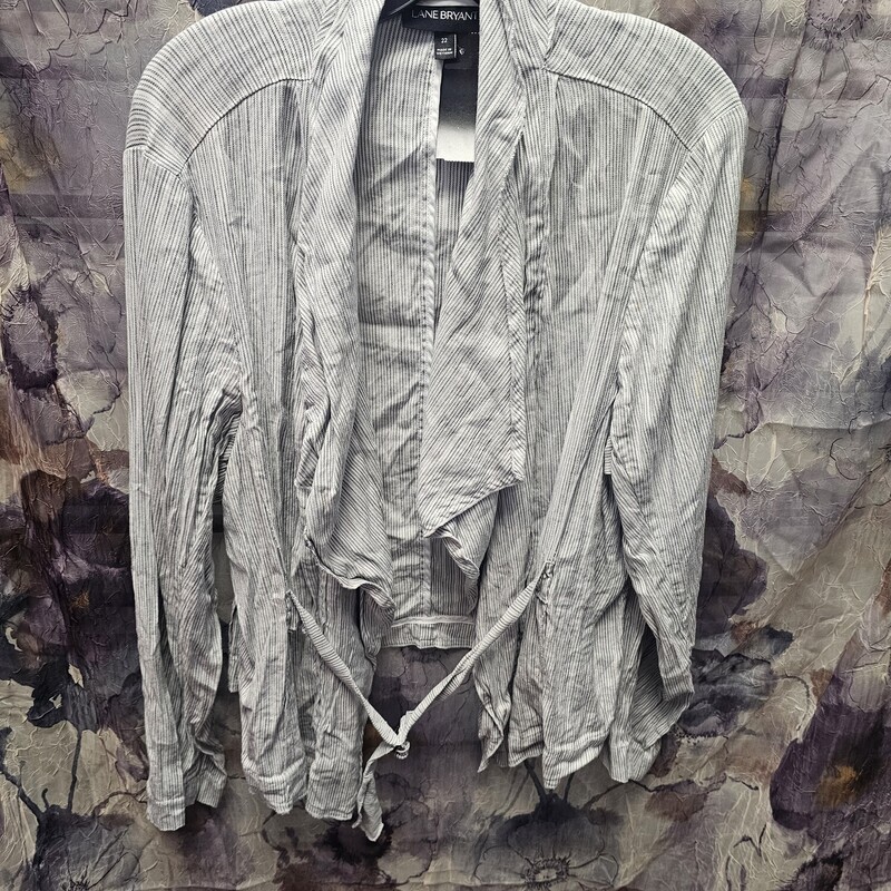 Jacket top that could also be used as a casual blazer. Grey and white stripe with attached belt.