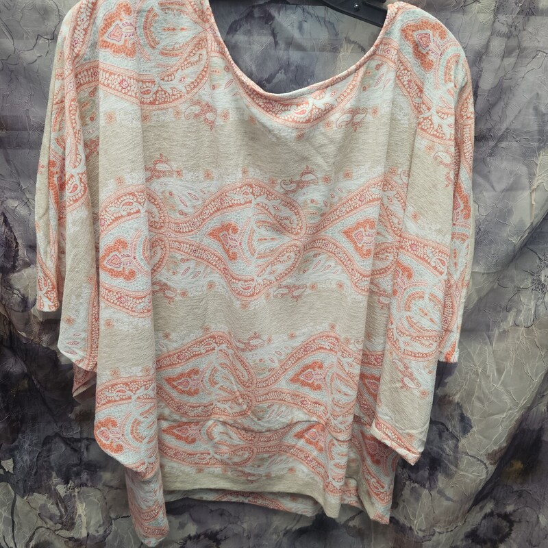 Cute half sleeve knit top in tan with sherbert orange print and touches of teal.