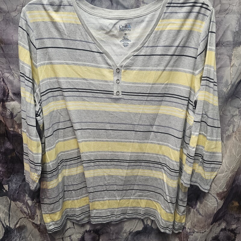 Half sleeve knit top in grey yellow white and black striping.