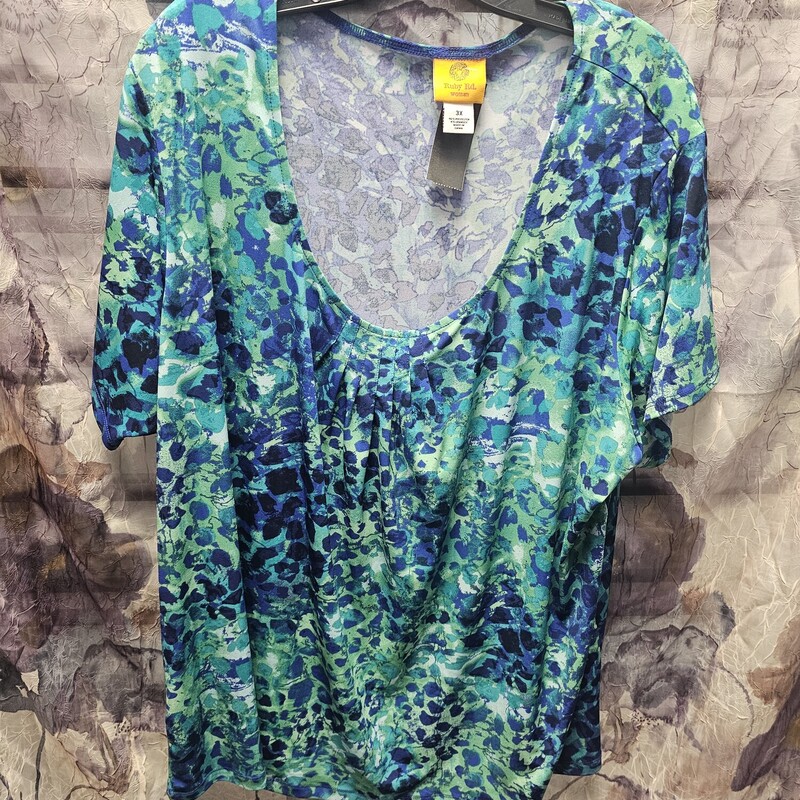 Green and blue print on a short sleeve blouse