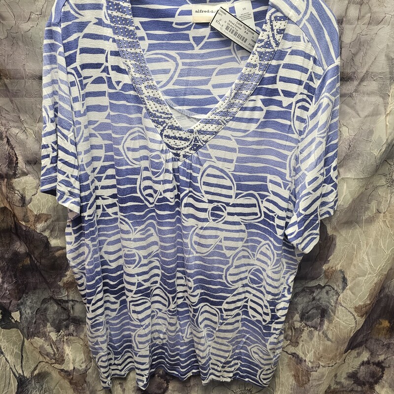 Short sleeve knit top in blue and white stripe with floral pattern and bling.