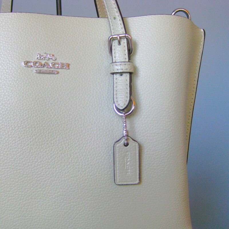 Like new Coach Mollie Tote<br />
in light green  , sage khaki.<br />
Matching wallet included<br />
Two handles and a removeable adjustable crossbody strap.<br />
BAG: 9.75 x 7.25 x 4<br />
handle drop: 4.5, strap drop: 24 max 17 min.<br />
<br />
Excellent pre-owned condition, no flaws.<br />
<br />
thanks for looking!<br />
#70399