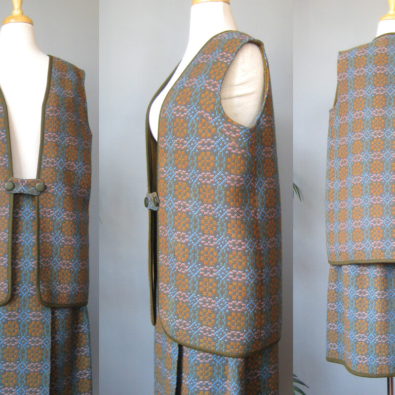 High quality tweed cape from the 1970s made in Wales.<br />
Brown, Orange and Blue medallion plaid tweed.<br />
This set consists of three pieces:<br />
<br />
Skirt: full wrap, unlined closes with 2 slides and a snap<br />
Flat measurements:<br />
waist: 15 hip: 21 length: 26<br />
green wool cape from the 1950s.  It's by Eclipse and it was made in Wales.<br />
<br />
Vest: 2 button tab closure<br />
Flat measurements:<br />
armpit to armpit: 20.5<br />
length: 28.25<br />
<br />
Cape: comes with a separate sash belt, 50 long, pockets, fully lined, buttons at the shoulder<br />
<br />
Gorgeous wool fabric, all in excellent condition except for a missing button along the shoulder of the cape and a damaged button on the vest.<br />
<br />
thanks for looking!<br />
#69032Wool 3pc Embrd Poncho, Green, Size: Large
