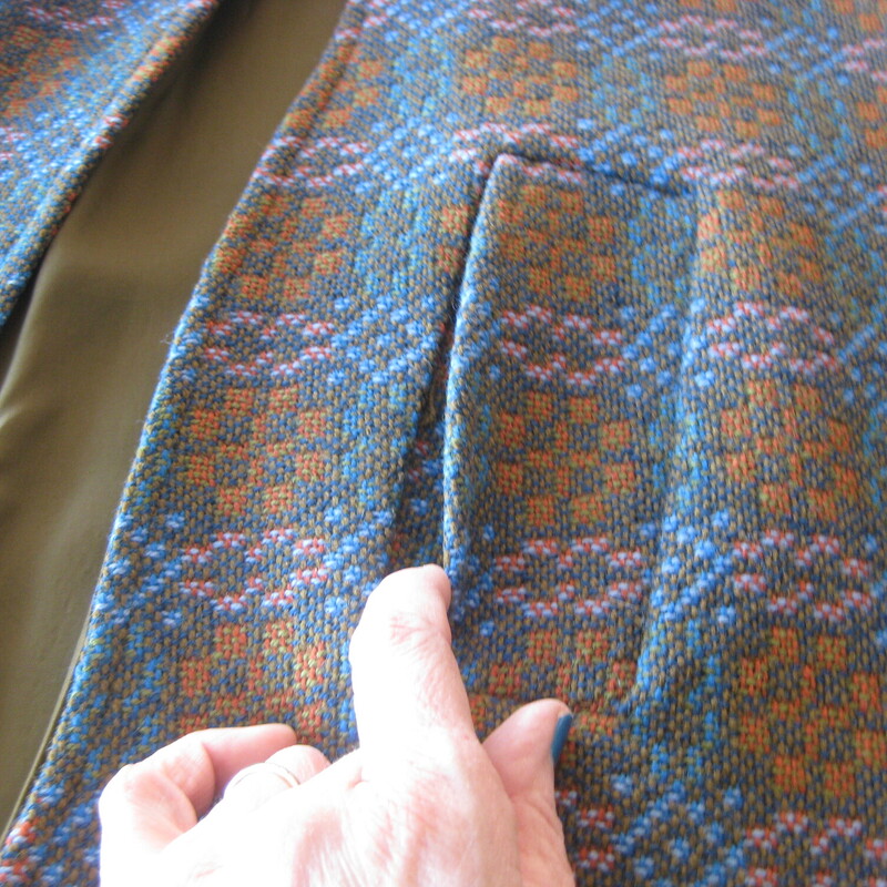High quality tweed cape from the 1970s made in Wales.<br />
Brown, Orange and Blue medallion plaid tweed.<br />
This set consists of three pieces:<br />
<br />
Skirt: full wrap, unlined closes with 2 slides and a snap<br />
Flat measurements:<br />
waist: 15 hip: 21 length: 26<br />
green wool cape from the 1950s.  It's by Eclipse and it was made in Wales.<br />
<br />
Vest: 2 button tab closure<br />
Flat measurements:<br />
armpit to armpit: 20.5<br />
length: 28.25<br />
<br />
Cape: comes with a separate sash belt, 50 long, pockets, fully lined, buttons at the shoulder<br />
<br />
Gorgeous wool fabric, all in excellent condition except for a missing button along the shoulder of the cape and a damaged button on the vest.<br />
<br />
thanks for looking!<br />
#69032Wool 3pc Embrd Poncho, Green, Size: Large