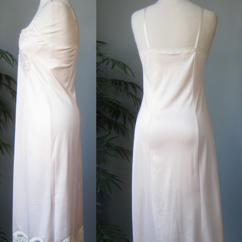 Pretty lace trimmed full slip in  palest pink has adjustable straps.<br />
the lace is cream colored and it appears on the bodice and at the hem.<br />
by Vanity Fair Marked size 34<br />
All nylon<br />
Excellent condition, no flaws<br />
<br />
The pink color is SUPER pale, almost white.<br />
<br />
Here are the flat measurements, please double where appropriate<br />
Armpit to Armpit: 16.25<br />
Waist: 16<br />
Hip: 20<br />
Length: 39.5 from top of one of the cups to the hem.<br />
<br />
Thank you for looking.<br />
#65487