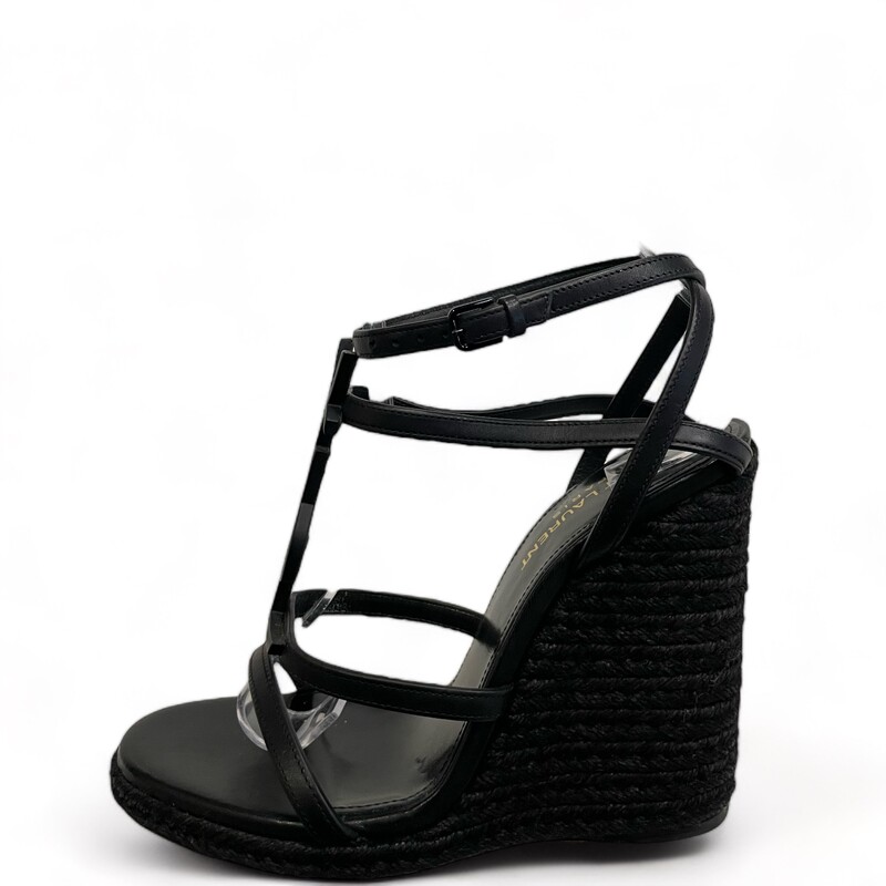 YSL Cassandre Black Wedges
Size: 36.5
Saint LaurentCassandra Wedge Espadrilles
Espadrilles made with metal free tanned leather with jute wedge heel, featuring straps decorated with metal YSL initials and an adjustable buckle.
Total Heel Height:  4.5 Inches
Arch Height:  4.1 Inches
Platform Height:  0.3 Inches
Leather Sole
Black Metal Hardware