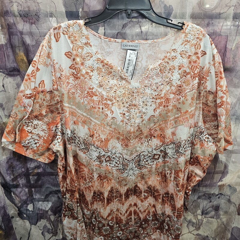 Short sleeve knit top in white and orange with bling and lace neckline.