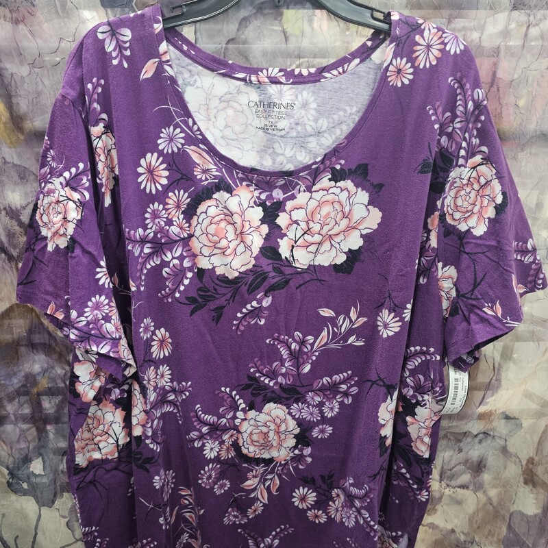Short sleeve tee in purple with bold floral print.