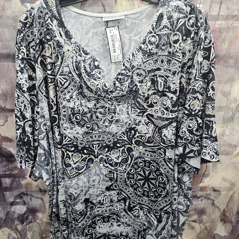 Short sleeve knit top in black white and grey print with lace and bling on the neckline.