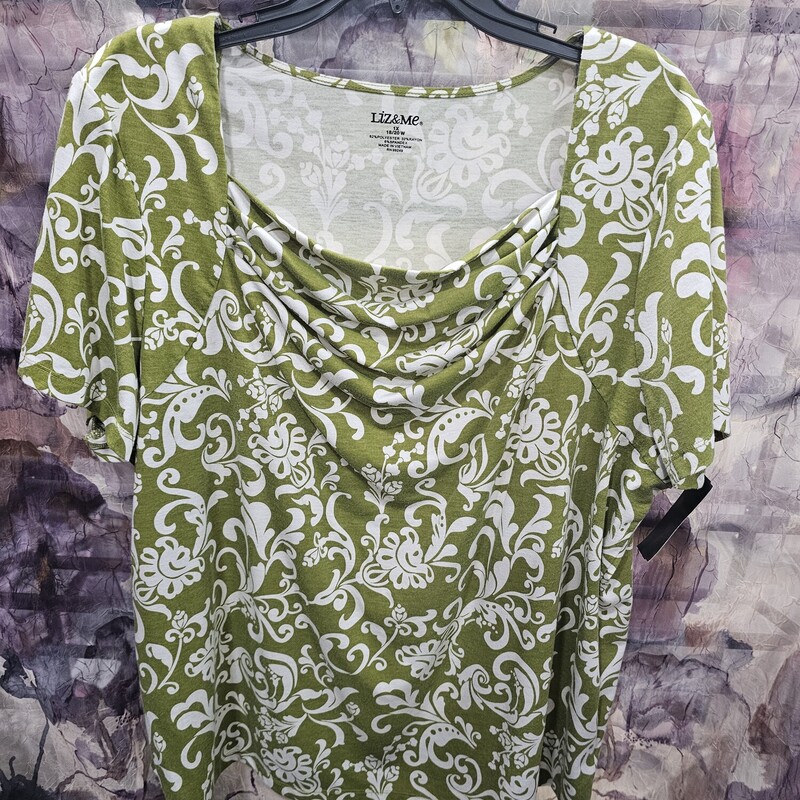 Short sleeve knit top in green and white print.