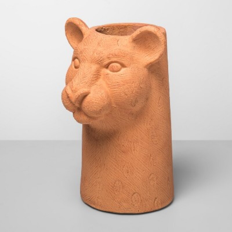Terracotta Leopard Head Vase
Terracotta colored Size: 7 x 13H