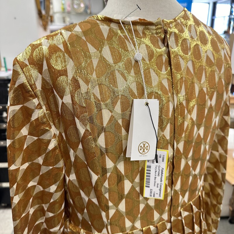 Tory Burch Bea Dress, Gold... new with tags and never worn!<br />
Size: 8