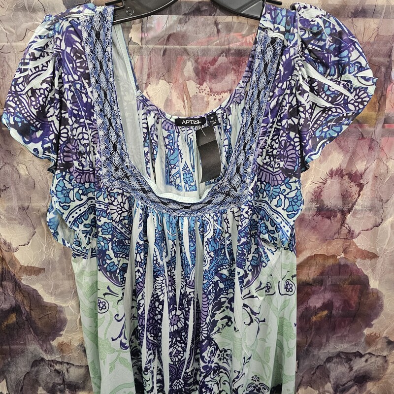 Cute boho style blouse in light blue and purple print.