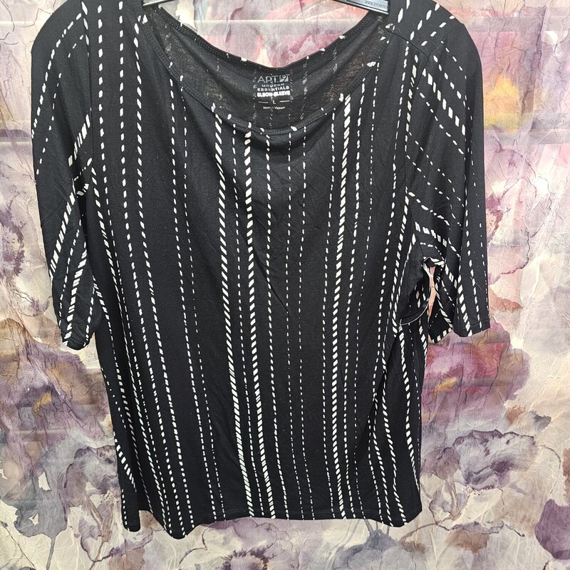 Short sleeve knit top in black with white print.