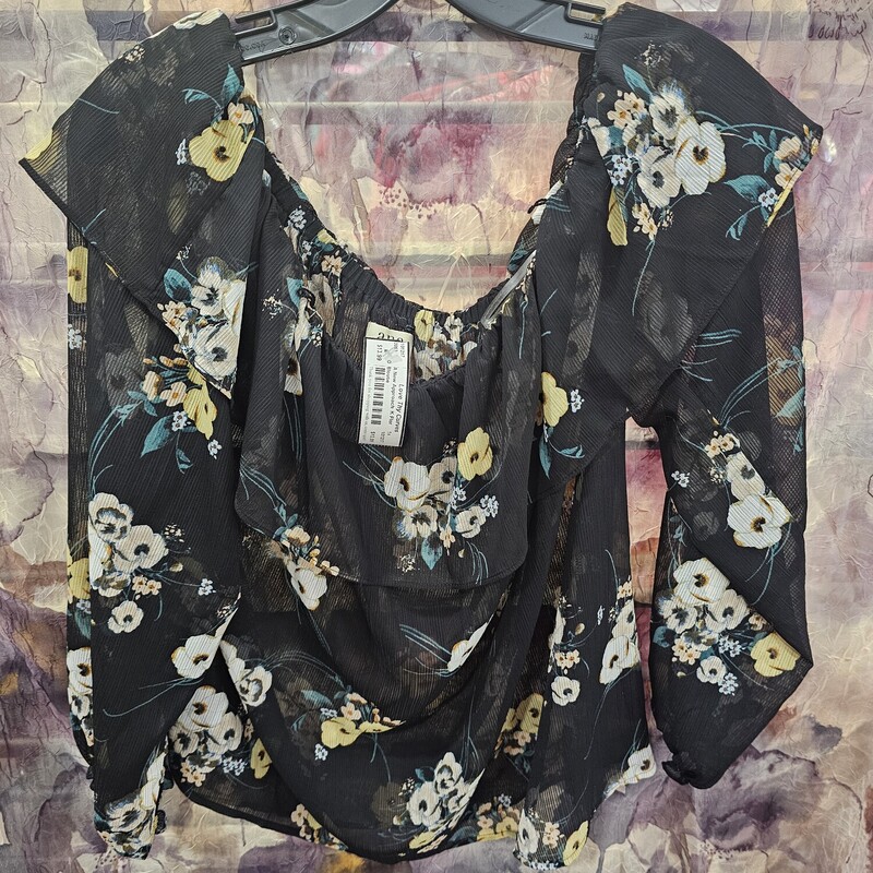 Sheer blouse in black with floral print.
