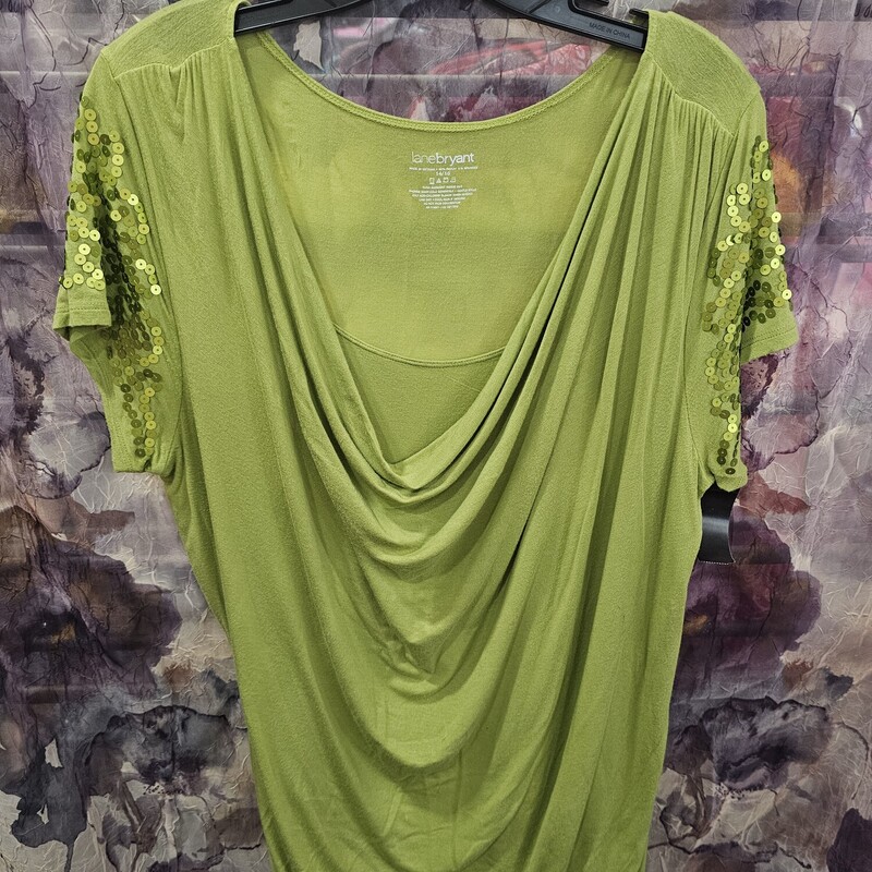 Super cute! Short sleeve knit top with all the sequins! in a lime green