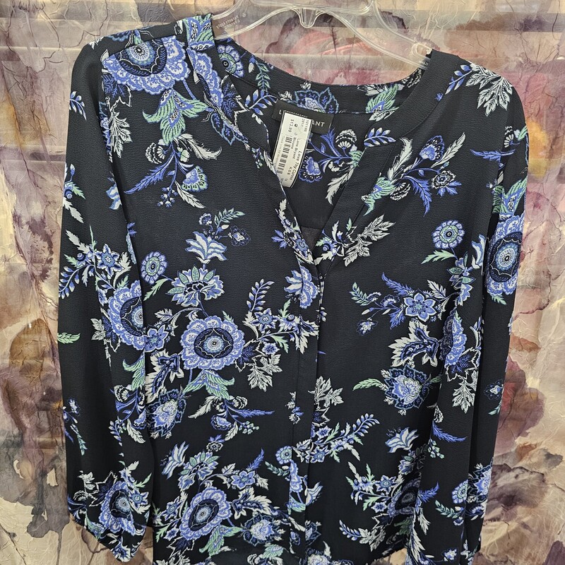 Long sleeve blouse in black with blue and green floral print.