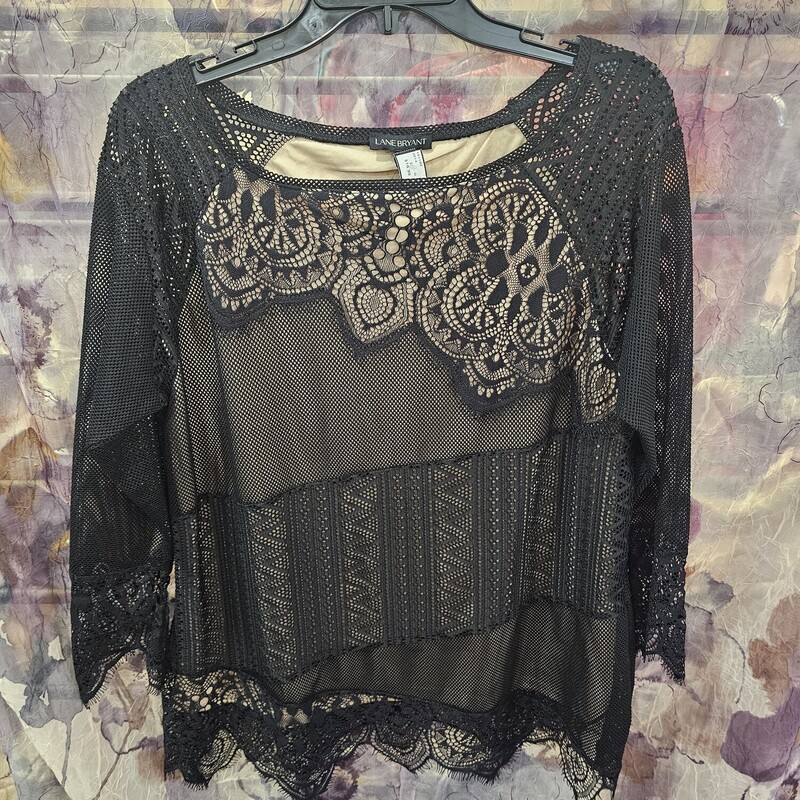 Brand new with tags, this blouse is double layered with a nude under layer and a sheer lace in black over layer that is sure to please and flatter. Brand new with tags and retails for $50