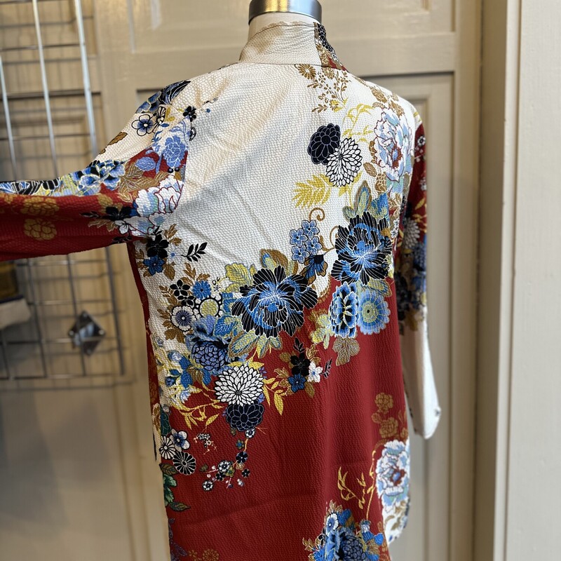 Citron Kimono, Ivory,Red Orange, Size: Medium<br />
100% Silk<br />
 3/4 Sleeve<br />
Red and Ivory with Blue,Teal, Green ,Yellow floral additions<br />
<br />
All Sales Are Final<br />
No Returns<br />
<br />
Pick Up In Store Within 7 Days of Purchase<br />
Or<br />
Shipping Is Available<br />
<br />
Thanks for shopping with us :-)
