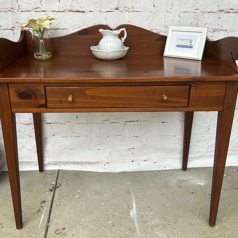 Table With Drawer. In good condition with minimal wear. Made by Ethan Allen. Size: 40L x 22D x 37T