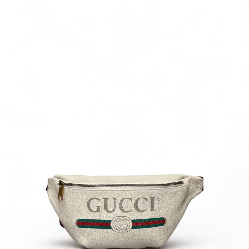 GUCCI Grained Calfskin Logo Belt Bag in White. This belt bag is white leather with a vintage Gucci logo. This bag has a nylon navy and red web belt that can be worn as a belt bag on the hip or waist. The front zipper opens to a beige natural fiber interior.

Dimensions:
Base length: 9 in
Height: 7.5 in
Width: 2 in
Belt: 46 in