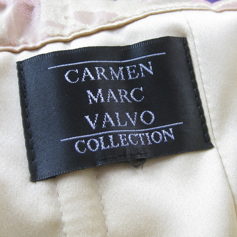 Really special cocktail / gala dress from Carmen Marc Valvo.
beautiful silk blend fabric in yellow and pink brocade
Strapless with a split in the center of the neckline.
fitted bodice and full poufy skirt supported by the stiffish fabric and a built in crinoline.
It has a belt made of the fashion fabric with a beautifully modeled rose that is actually a pin, so you can remove it if desired (and pin it to your date's lapel? )

Inside you have all the structure you need to keep the dress up - a complete boned long line bra is built right in.

No size tag, I am calling it a size large
Here are the flat measurements, please double where appropriate:

Armpit to Armpit: 2
Waist:1
Hips: basically free, you'll want your hips to be less than 48 around for it to sit right
Length: 34 I measured this from the underarm to the hem.

Perfect condition!
Thanks for looking!
#3681