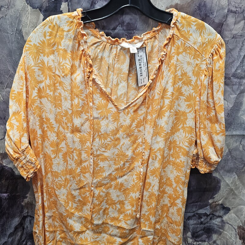 Short to half sleeve blouse in orange print.