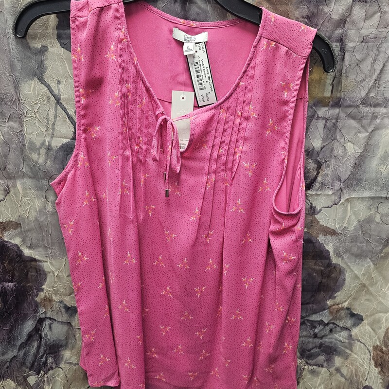 Brand new with tags and retails for $36!  Sleeveless pink blouse with sublte print in white orange and navy.
