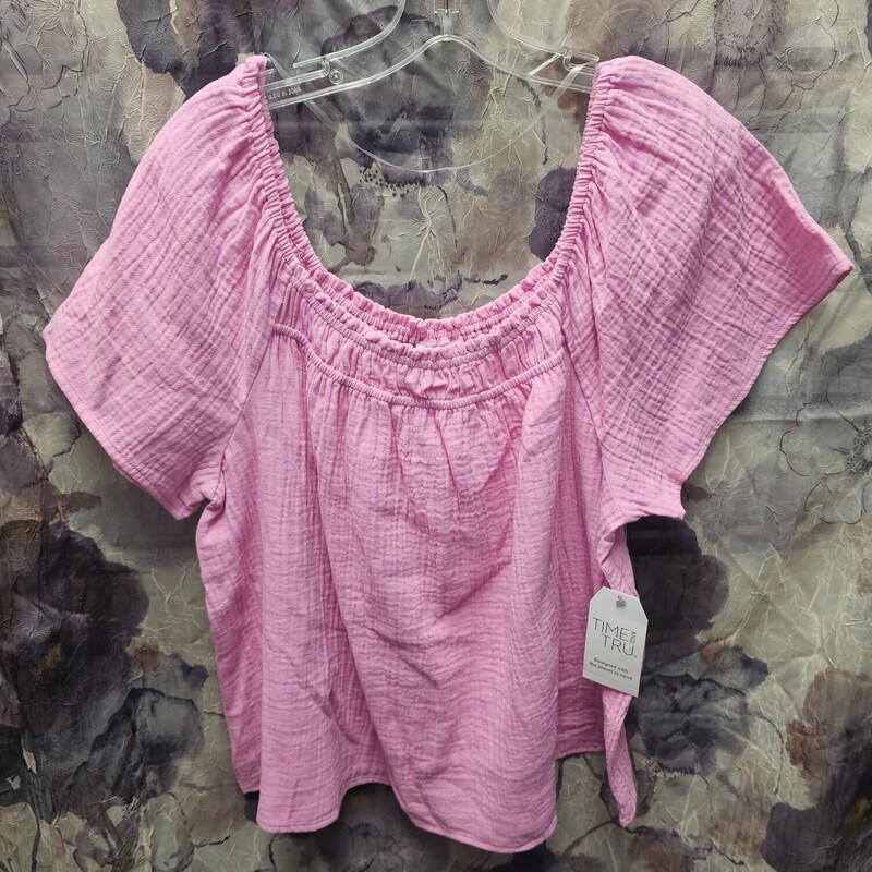 Brand new with tags, this blouse has short sleeves and is done in pink.