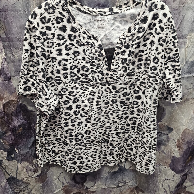 Short sleeve knit top in white with brown and black animal print.