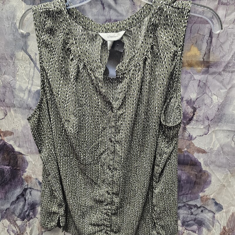 Button up front sleeveless blouse in grey with black print.