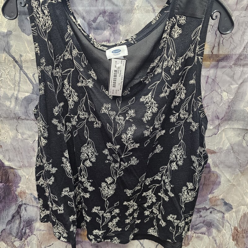 Tank top in black. Sheer black panel and knit black and beige floral printed panel.