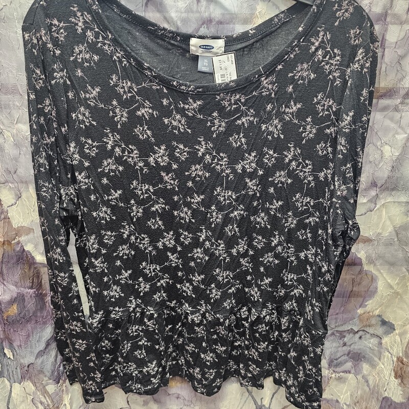 Long sleeve knit top in black with grey floral print.