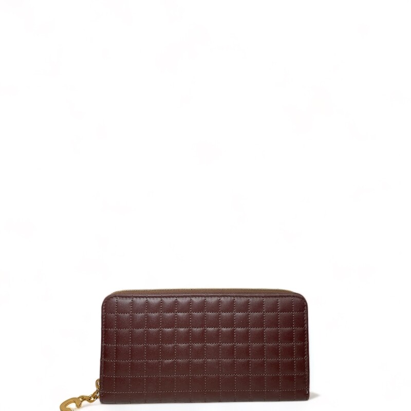 Celine  Continental Quilted Calfskin Large Wallet
Brown Leather
Gold-Tone Hardware
Leather Lining with 2 compartments, 12 credit card slots, 1 zipped pocket and 1 flat pocket
Exposed Zip Closure
Dimensions:
Height: 4
Width: 7.5
Depth: 0.75