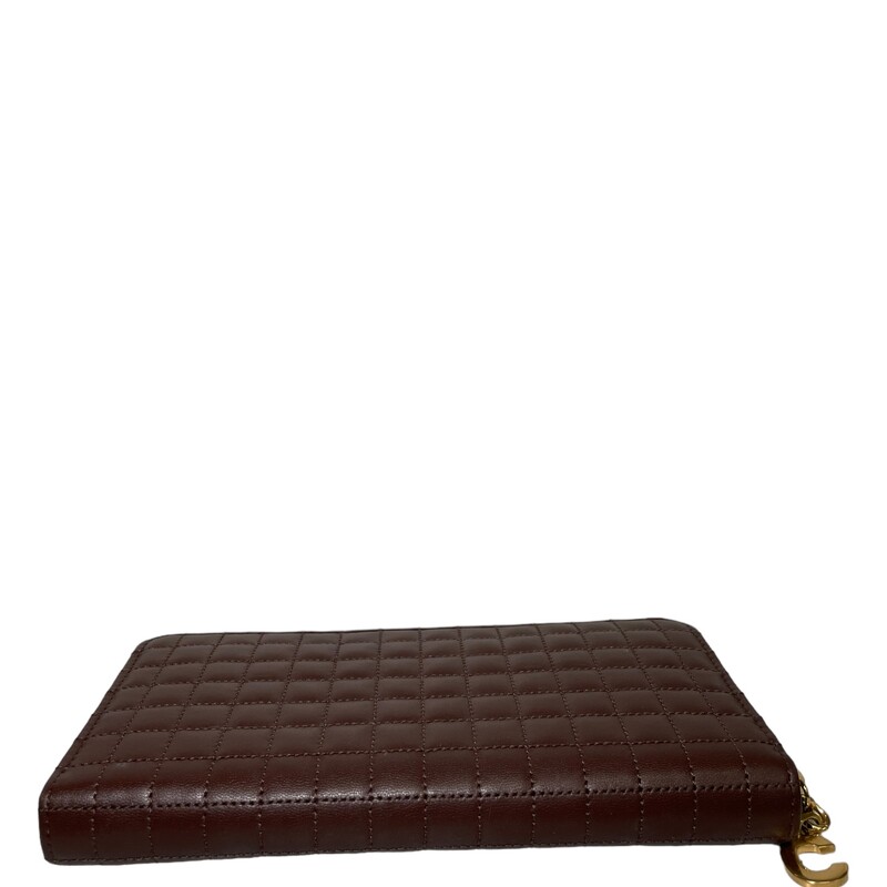 Celine  Continental Quilted Calfskin Large Wallet
Brown Leather
Gold-Tone Hardware
Leather Lining with 2 compartments, 12 credit card slots, 1 zipped pocket and 1 flat pocket
Exposed Zip Closure
Dimensions:
Height: 4
Width: 7.5
Depth: 0.75