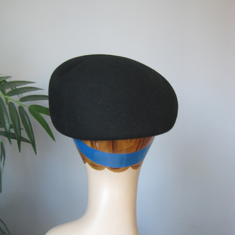 Wool Bowler W/ Pin, Black, Size: None
This is a sculptural black hat from the 1950s.  It will basically read as a pillbox.  It's made of black wool felt and has a gorgeous star like brooch attached in gold tone metal, rhinestones and coral colored round beads.
The inner brim measures 21 1/2 around.  You can wear it as shown, kind of front and center, try it tilted or further back as well.

Thanks for looking!
#69368