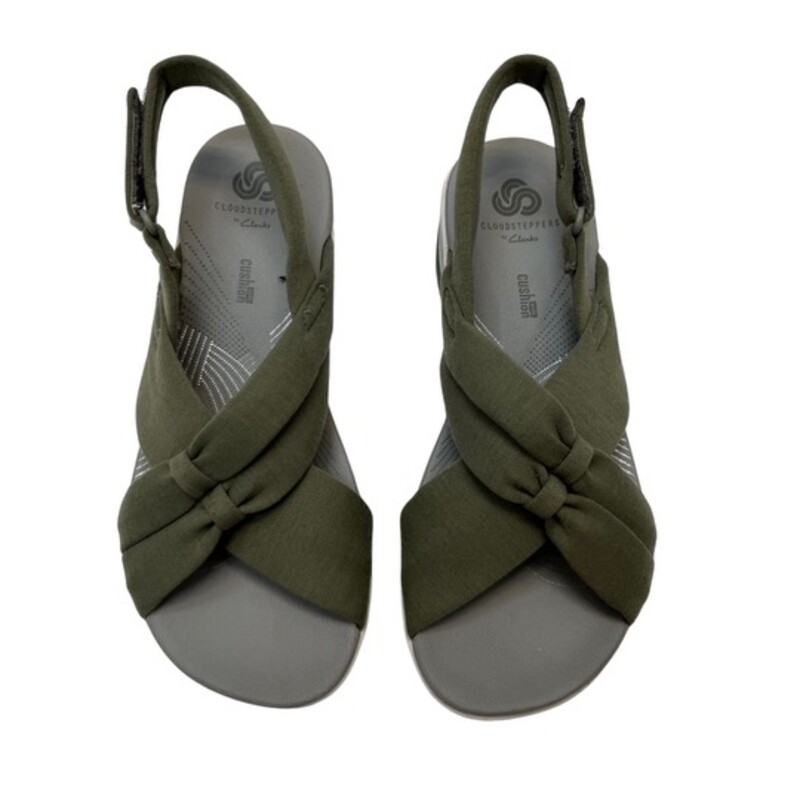 NEW Cloudsteppers by Clark Arla Belle Sandals<br />
Color: Olive<br />
Size: 5.5<br />
Flexible crisscross straps with knotted detail, adjustable hook-and-loop backstrap<br />
Padded insole, EVA midsole, textured outsole<br />
Bottom construction: Arla<br />
Approximately 1-5/8H heel<br />
Fit: true to size<br />
Fabric upper; man-made balance