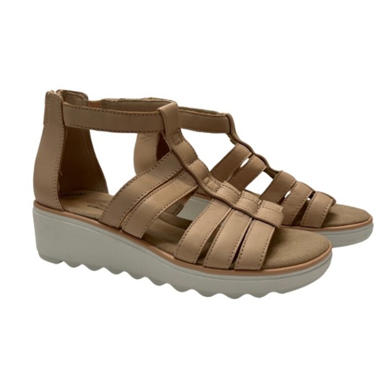 NEW Collectioon by Clarks Jillian Nina Sandals<br />
Color: Blush<br />
Size: 6<br />
Ortholite for ultimate comfort, cushioned insole<br />
1.92 heel<br />
Round-toe wedge sandal with a rear zipper back<br />
Strappy gladiator sandal<br />
Leather upper, textile lining, manmade outsole<br />
Hand Wash