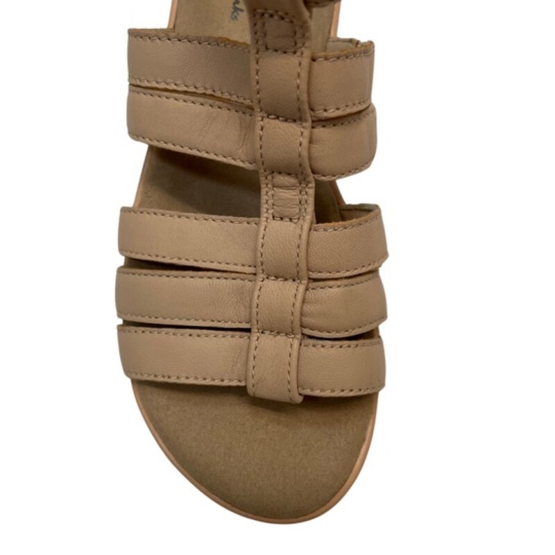 NEW Collectioon by Clarks Jillian Nina Sandals<br />
Color: Blush<br />
Size: 6<br />
Ortholite for ultimate comfort, cushioned insole<br />
1.92 heel<br />
Round-toe wedge sandal with a rear zipper back<br />
Strappy gladiator sandal<br />
Leather upper, textile lining, manmade outsole<br />
Hand Wash