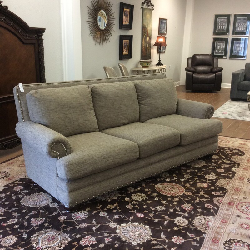 This is a very nice sofa from Lazboy! Traditional in style,
in comes with the rolled arms and a bold nailhead trim. Back cushions are attached and it's in very good condition. It would make a great \"napper\" too!