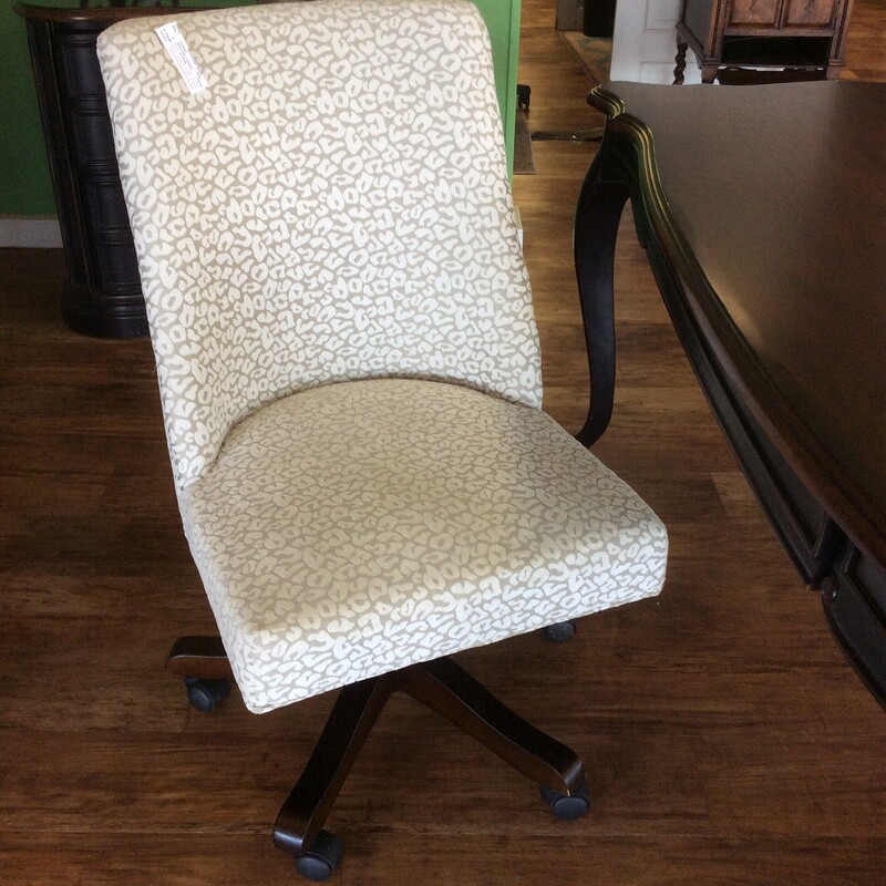 Beautiful! This desk chair by Safavieh is height adjustable and swivels. Upholstered in a white and taupe leopard pattern.
