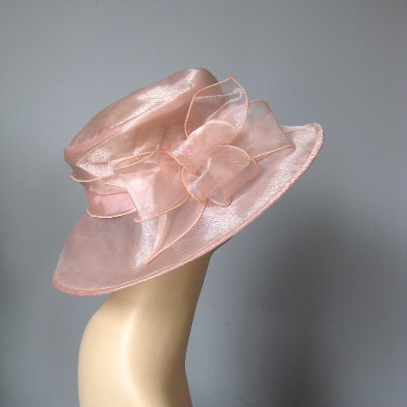 Perfect for a summer special ocassion, a visit to the track or a special Sunday Church event<br />
this is a brand new with tags organze hat by Josette<br />
It's pale peach pink, with a wide brim and a pretty bow at the crown.<br />
So lightweight and easy to keep on the head<br />
Crisp and sturdy.<br />
<br />
The diameter of the hat is 14<br />
and the inside circumference is 22.25<br />
<br />
perfect brand new condition.<br />
Thanks for looking!<br />
#70975